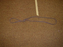 Band set-up.  Tie a knot in a resistance band to make a small loop.